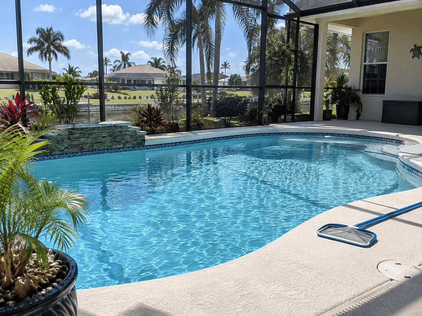 Residential pool service at a clean backyard pool in Cape Coral