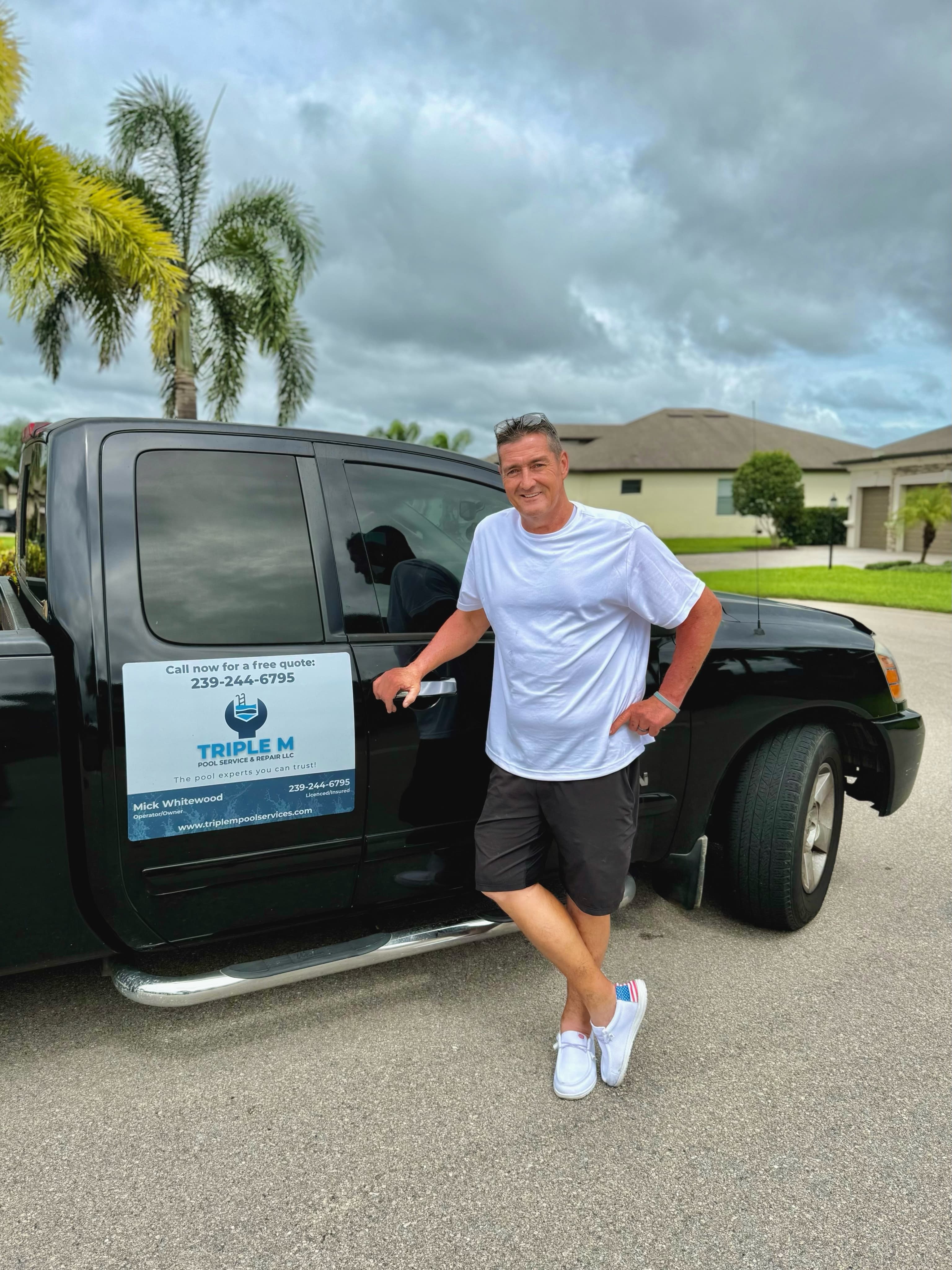 Triple M Pools owner Mick Whitewood beside his work truck