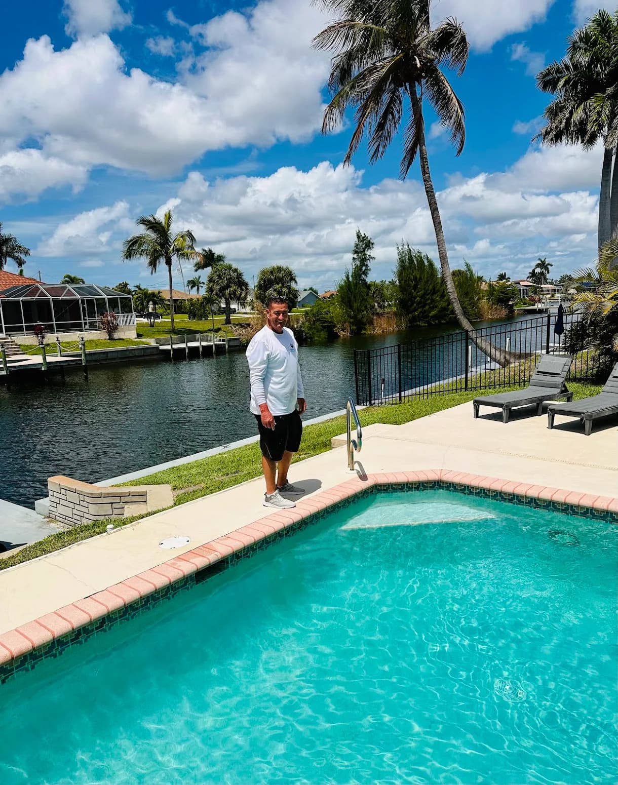 Mick Whitewood beside a residential pool in Cape Coral